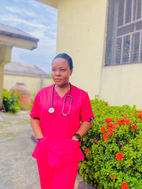 Nurse wearing SIMS medical scrub design.
